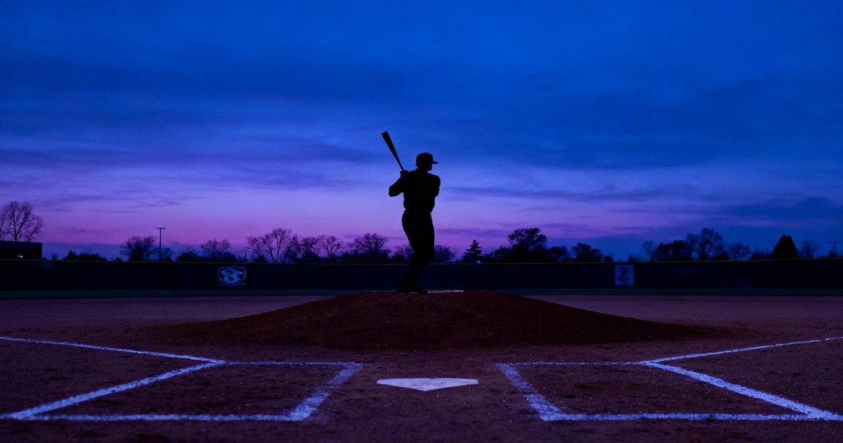Batter and pitcher silhouettes on a mound.